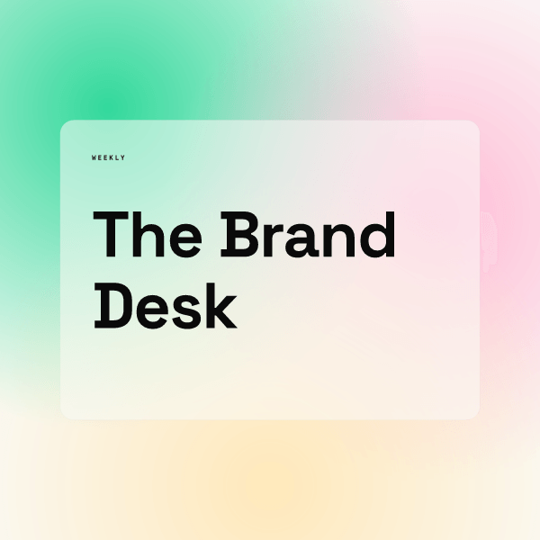 Square newsletter logo concept from the AURORA demo brand: a soft green, pink and peach blurred background with a pale rounded card, a tiny WEEKLY label and the words The Brand Desk in large black type